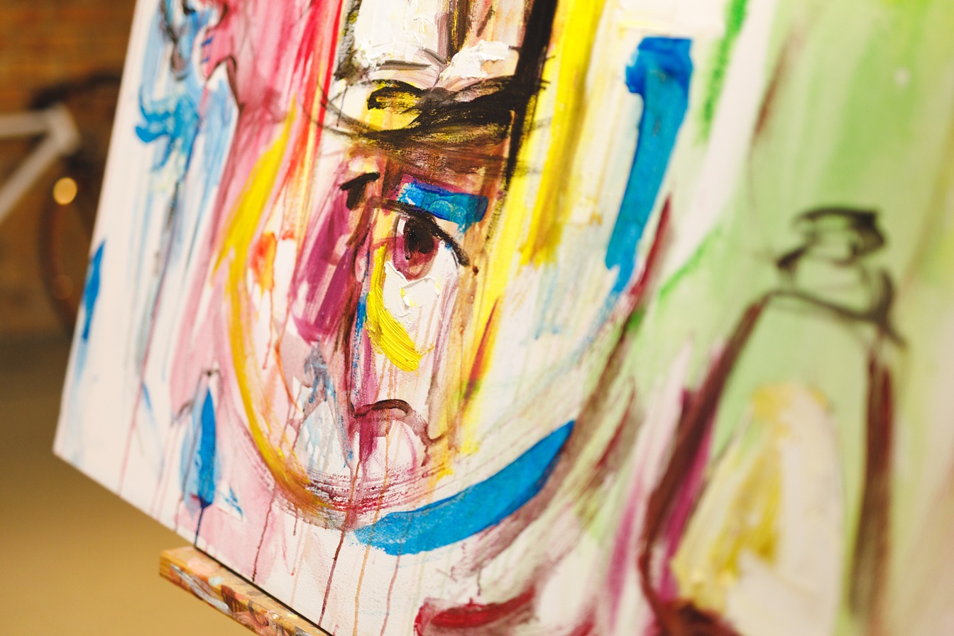 Close up of modern abstract oil painting on canvas sitting on easel in artists studio. creation and inspiration at an artists painting studio
